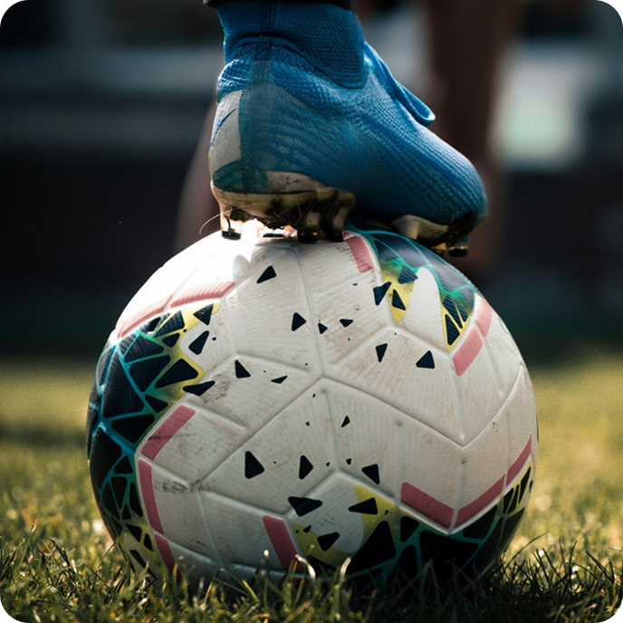 Football boot on ball